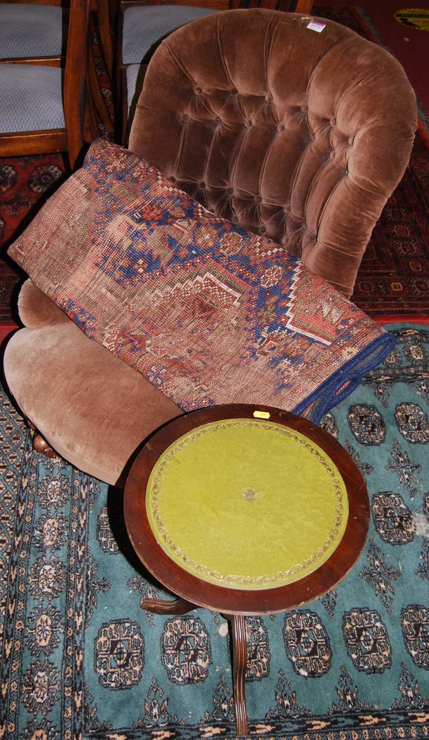 A mid-Victorian walnut framed and buttoned upholstered nursing chair; together with a Persian Tabriz