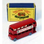 A Matchbox Lesney No. 5 Routemaster bus comprising of red body with grey plastic wheels and