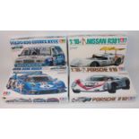 Four various boxed Tamiya 1/24 scale plastic race car kits to include an Avex Dome Mugn NSX race