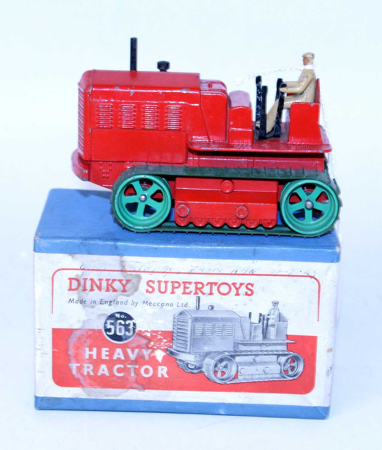 A Dinky Toys No. 563 heavy tractor comprising of red body with green wheels and green tracks,
