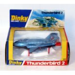 A Dinky Toys No. 106 Thunderbird 2 comprising of metallic blue body with red boosters and red