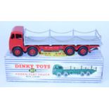 A Dinky Toys No. 905 Foden flat truck with chains, comprising of second type red cab and chassis