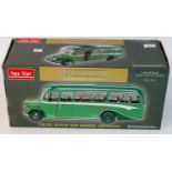 A Sunstar 1/24 scale diecast model of a Bedford OB Duple Vista coach finished in green, housed in