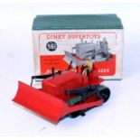 A Dinky Toys No. 561 Blawknox bulldozer, comprising red body with green tracks and driver figure,