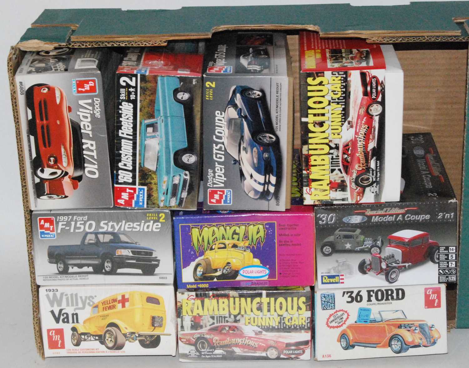 Ten various boxed Revell, AMT and Polar Lights 1/25 scale plastic sports car and race car kits to