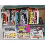 Ten various boxed Revell, AMT and Polar Lights 1/25 scale plastic sports car and race car kits to