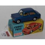 A Corgi Toys No. 251 Hillman Imp comprising of metallic blue body with a yellow interior, spun