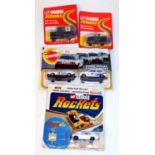 A Corgi Juniors and Corgi Rockets carded diecast group to include No. 76 US Military Jeep, No. 79