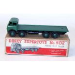 A Dinky Toys No. 502 Foden flat truck, comprising of first type green cab, and back with black