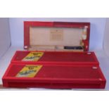 A pre-war Trix Twin set box and 4 various red post-war set boxes, some containing track and