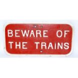 A small cast iron Southern Railway oblong white on red 'Beware of the Trains' warning