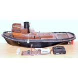 A wooden and GRP hulled part complete radio controlled operated tug boat, requires completion to