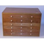 Six drawer Meccano dealer's cabinet, light oak, without header board and display card, contains