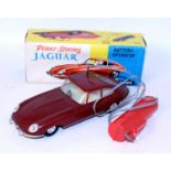 A Made in Hong Kong No. 226 plastic and battery operated model of a Jaguar E type Coupe finished