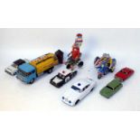 A collection of various tinplate loose motorcycles, novelty toys and vehicles to include tinplate