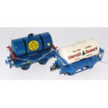 Two Hornby repainted tank wagons, type 2 chassis blue 'Colas' and type 3 chassis United Dairies (