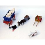 One tray containing a quantity of various white metal modern release horse drawn farm miniatures,