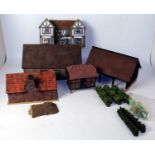 Two boxes containing a quantity of very well made farm buildings and facades, mixed manufactures