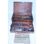 Small wooden chest containing well used 1920s Meccano