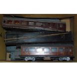 11 wooden bodied bogie coaches all in need of renovation, some without wheels or bogies