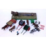 A collection of Britains, kit built and later adapted white metal horse drawn farming implements and