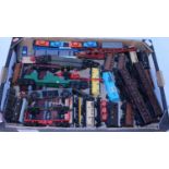 Tray containing approx 35 various makes 00 and H0 wagons including Triang NATO searchlight wagon,