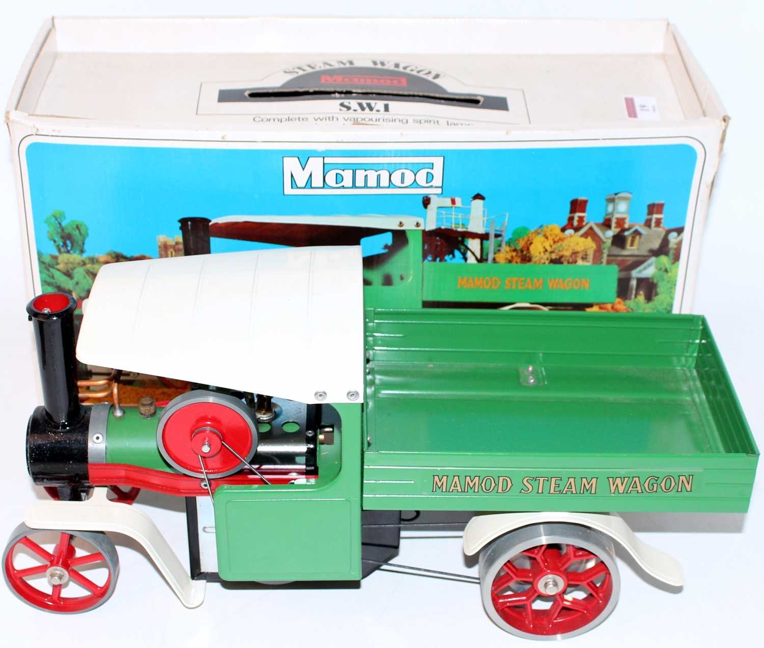 A Mamod SW1 steam wagon comprising of green, white and red body of usual specification, housed in