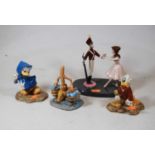 A collection of four Royal Doulton Disney Showcase Collection figures, to include Shostakovich's