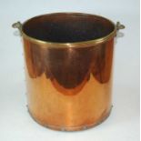 A 20th century riveted copper and brass coal bin, of plain cylindrical form, 30cm high