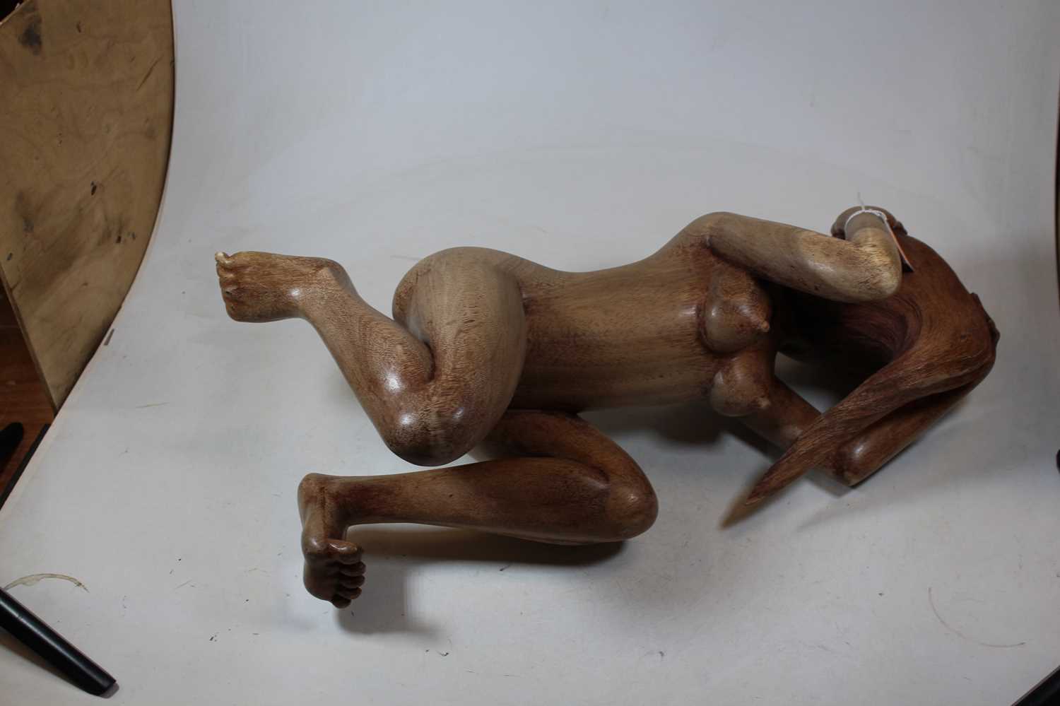 An Eastern carved hardwood figure of a nude woman, shown on all fours, h.22cm - Image 4 of 4