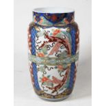 An early 20th century vase, of tapered cylindrical form, decorated in the Imari palette in shades of