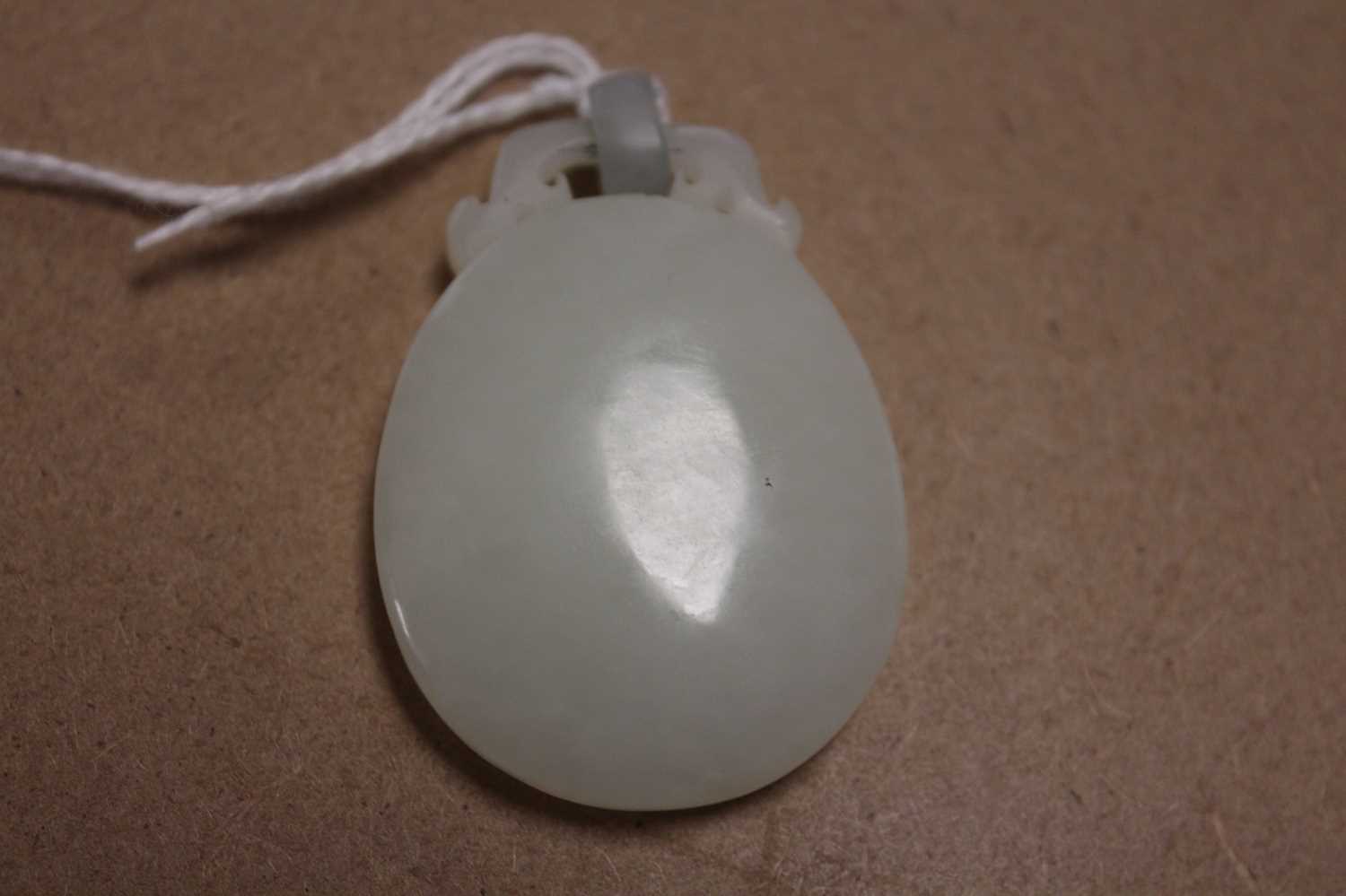 A Chinese pale celadon jade pendant, 41mm (excluding bale), 17.4g - Bild 5 aus 16