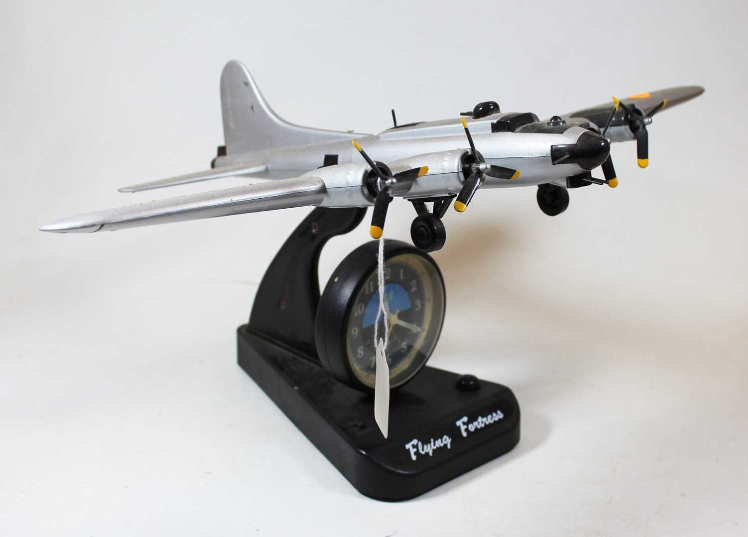 An ASA Flying Fortress quartz alarm clock, in the form of a military aircraft, h.22cmCondition