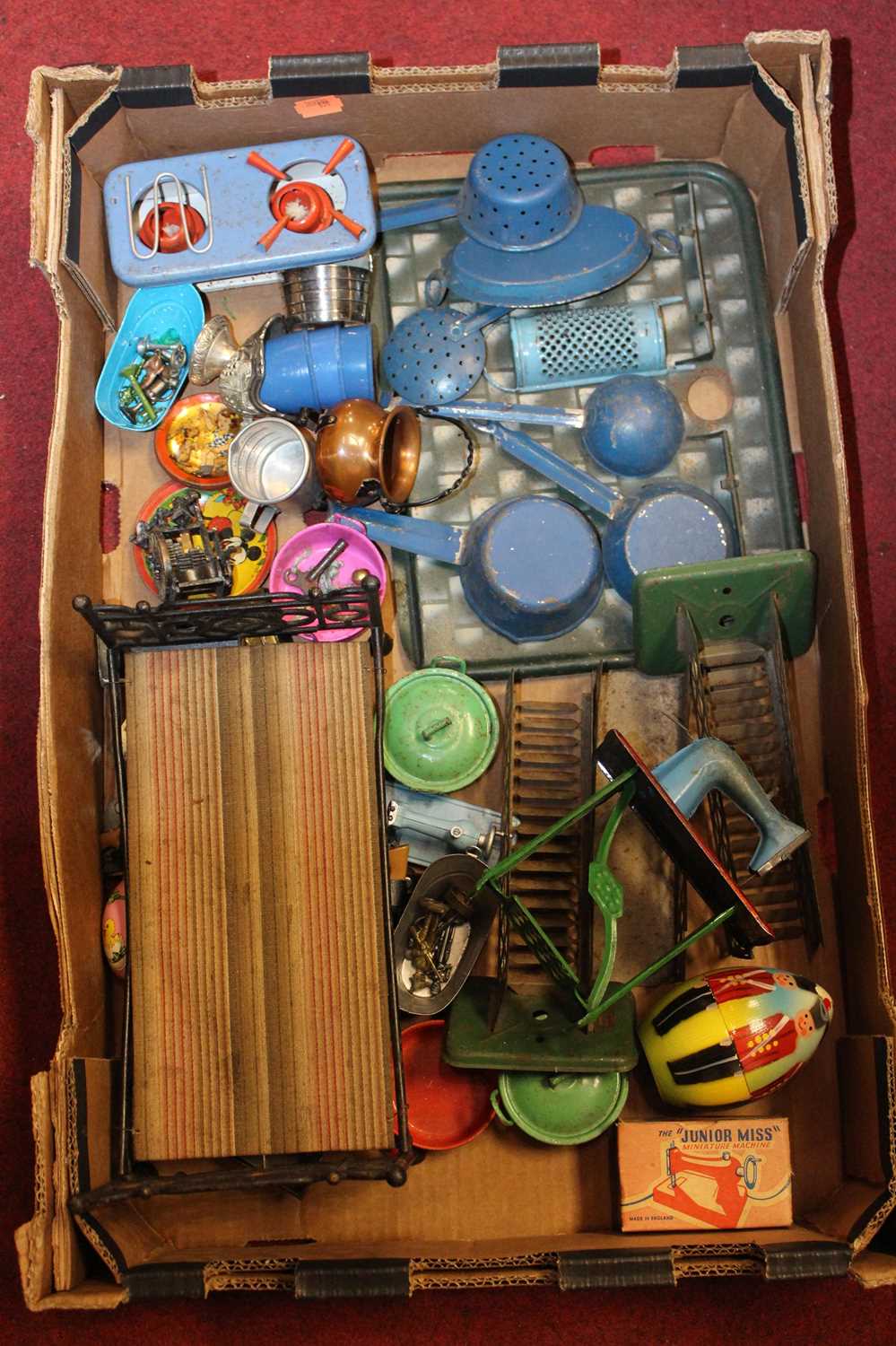 A box of miscellaneous mainly tin plate dolls house furniture and accessories to include the