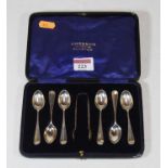 A cased set of six coffee spoons with sugar tongs