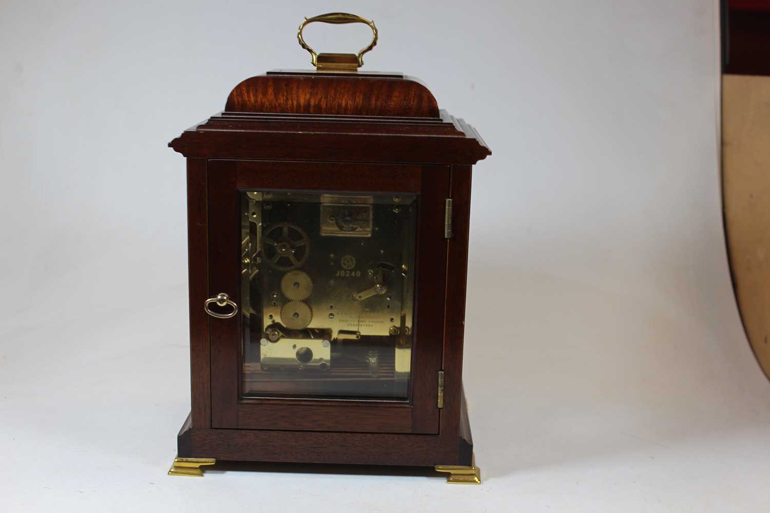 An 18th century style walnut bracket clock, the silvered chapter ring showing Roman numerals, the - Image 4 of 8