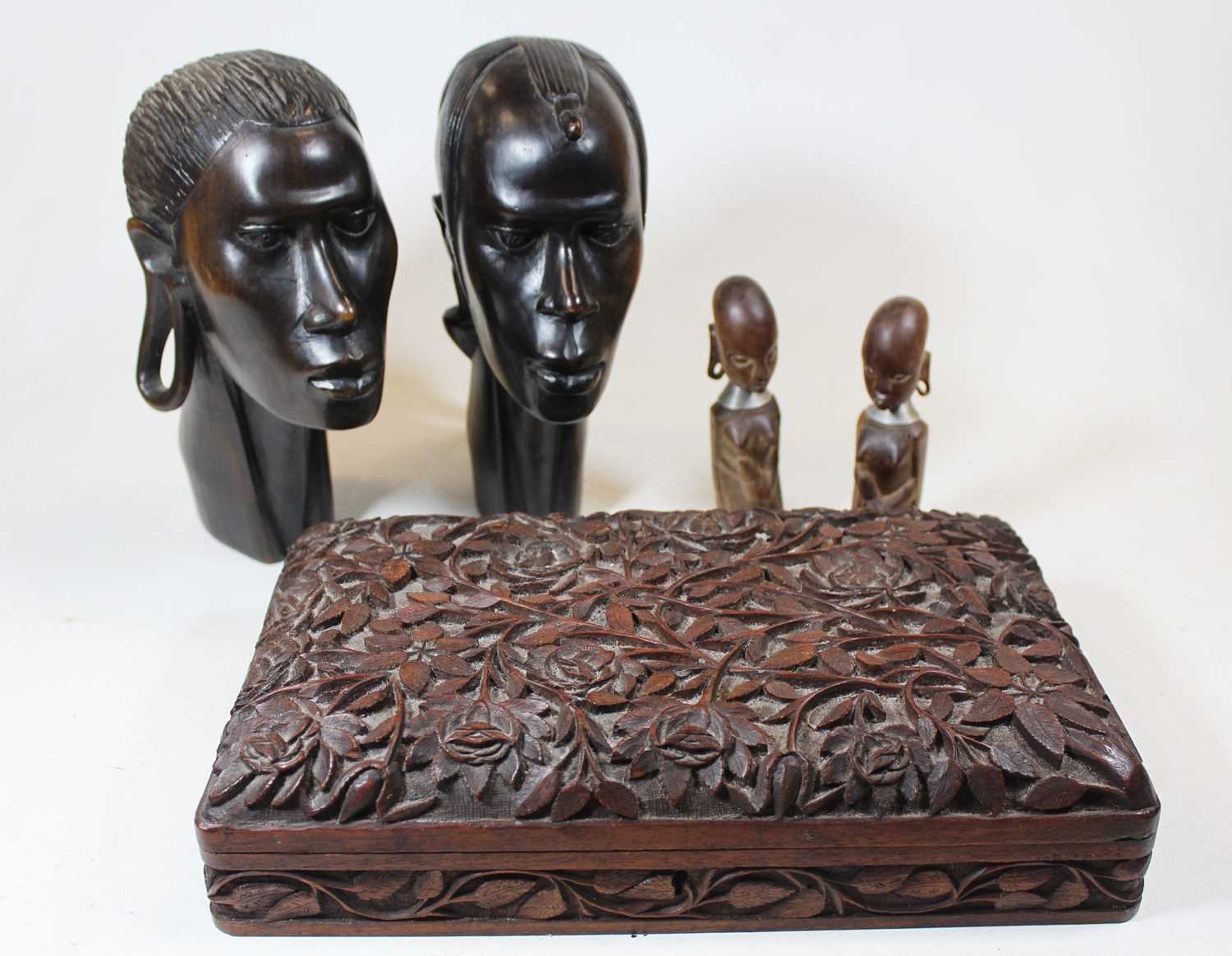 A pair of 20th century African carved hardwood portrait heads; together with a Chinese Imari palette