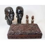 A pair of 20th century African carved hardwood portrait heads; together with a Chinese Imari palette