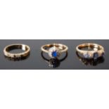 Three rings, comprising a yellow metal, sapphire and diamond five-stone half hoop eternity ring,