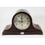 A 1920s mahogany cased mantel clock, having a silvered dial with Arabic numerals and eight day