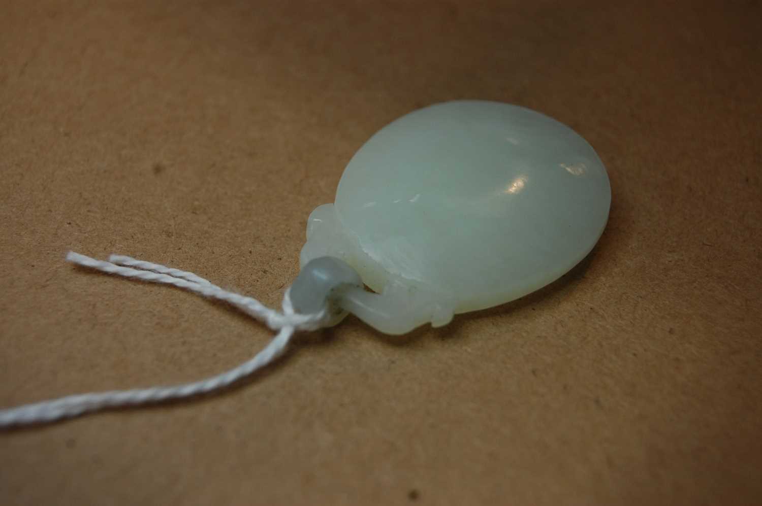 A Chinese pale celadon jade pendant, 41mm (excluding bale), 17.4g - Bild 11 aus 16