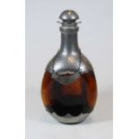 A modern continental brown glass and pewter mounted decanter and stopper, with decanter collar