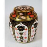 A Royal Crown Derby vase and cover, of barrel form, decorated in the Imari palette, pattern No.1128,