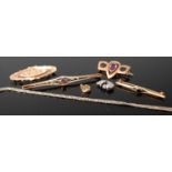 An Art Nouveau gilt metal and amethyst set bar brooch; together with three circa 1900 base metal bar