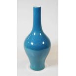 A Chinese export turquoise glazed bottle vase, the cylindrical neck above a globular body, 30cm