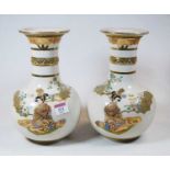 A pair of Japanese Taisho period vases, each having flared rim to a slender neck and bulbous lower