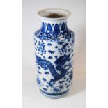 A Chinese export blue & white porcelain vase of rouleau form decorated with four clawed dragon,