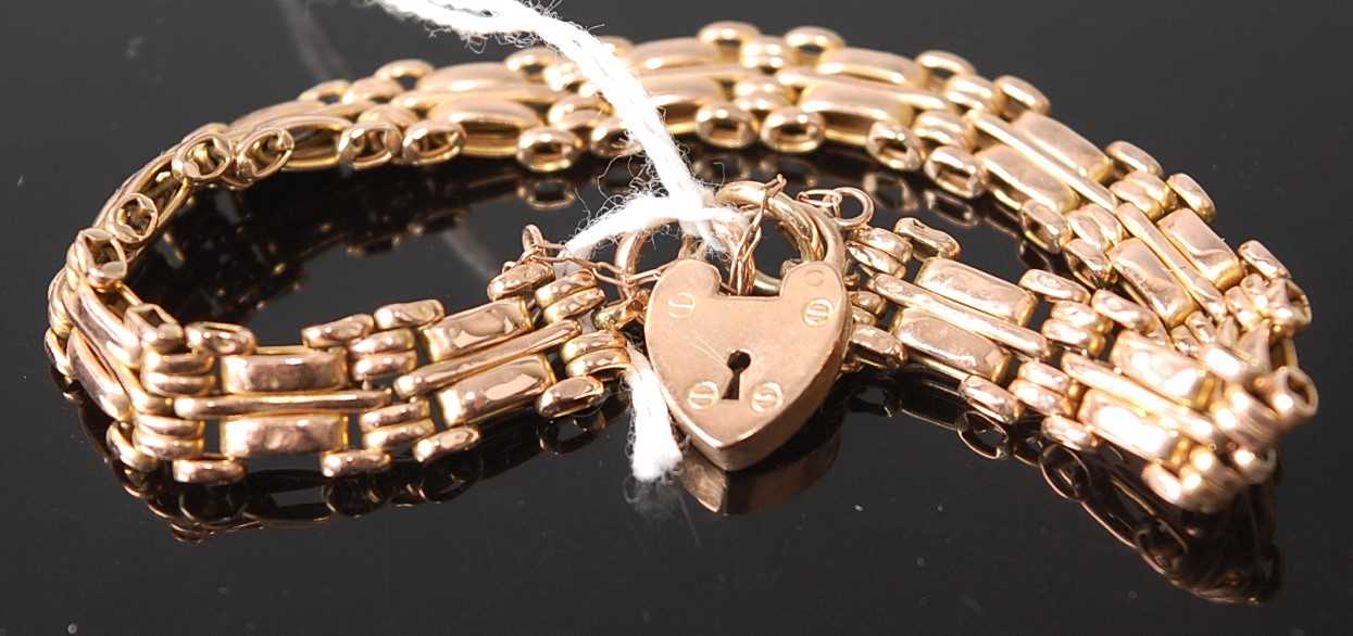 A 9ct gold gatelink bracelet, with heart shaped padlock clasp and safety chain, 12g