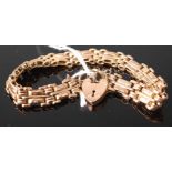 A 9ct gold gatelink bracelet, with heart shaped padlock clasp and safety chain, 12g