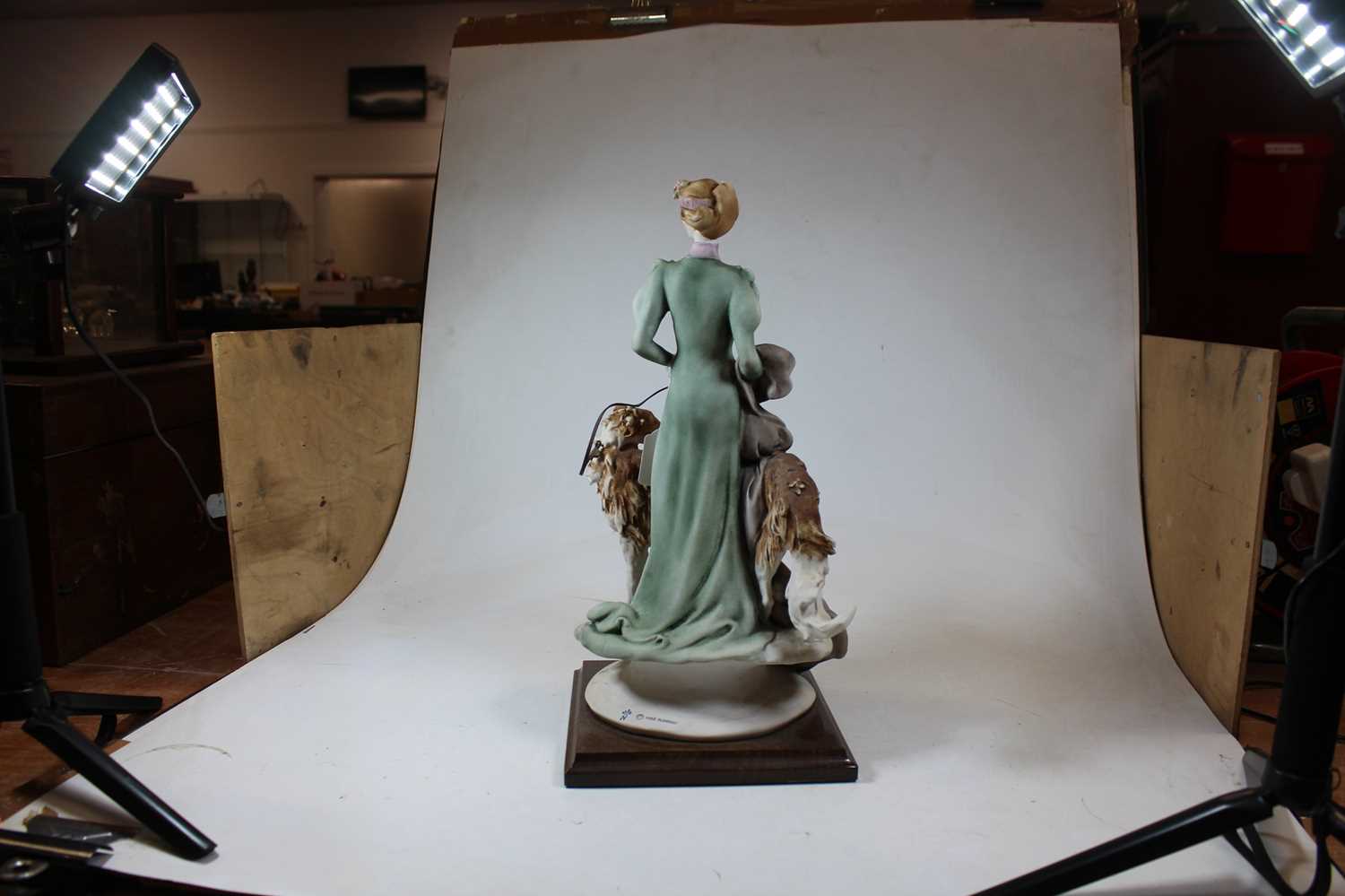 An Italian bisque figure of a Lady with two dogs by Giuseppe Armani, mounted on a moulded wooden - Image 4 of 8